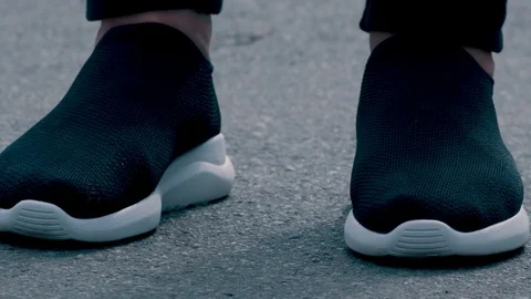 Water poured on sneakers closeup Stock Footage 117546375