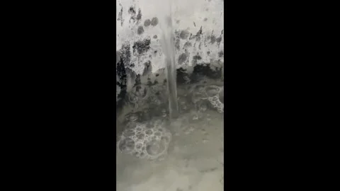Water is pouring into a bucket Stock Footage 284224468