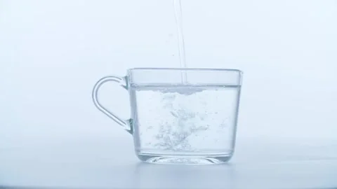 Water pouring in a cup Stock Footage 321844060