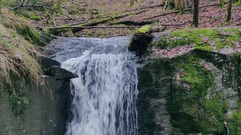 Water Pouring Down a Small Waterfall in Sweden Stock Footage 100082589