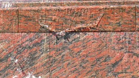 Water pouring down the stone wall Stockbeeldmateriaal 90489629