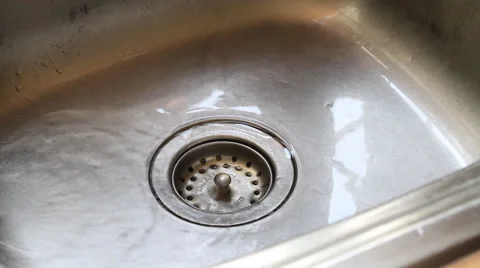 Water pouring in kitchen sink Stock-Footage 67730529