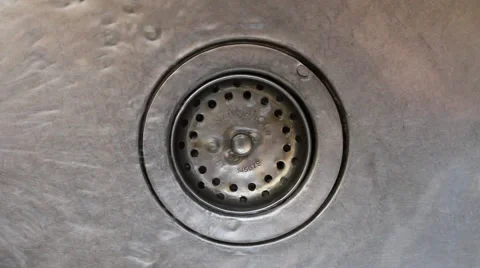 Water pouring in kitchen sink Video stock 67730702