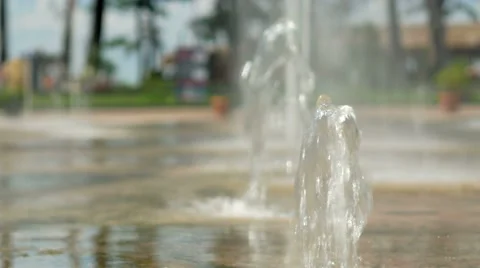Water pouring out of the ground. The flow of water falls to the ground Stock Footage 67615330