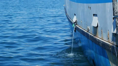 Water Pouring Out of Small Window on Fishing Boat Side Stock Footage 344313318
