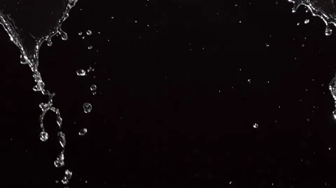 Water pouring over black background, slo... | Stock Video | Pond5