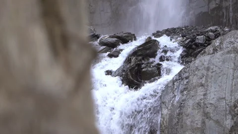 Water Pouring Over Rocks from Waterfall Stock Footage 303655554