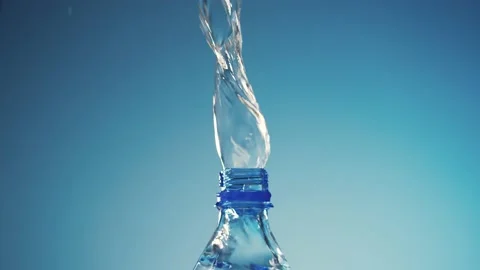 Water pouring into a plastic bottle Stock Footage 182357326