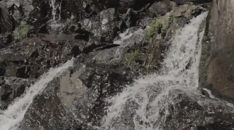 Water pouring on rocks Stock Footage 40018865