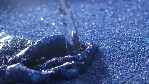 Water pouring in sand Stock Footage 165030243