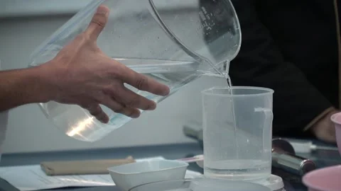 Water Pouring Science Experiment Stock Footage 317472402