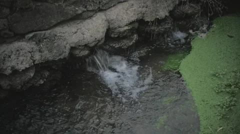 Water Pouring into stream Stock Footage 58929565