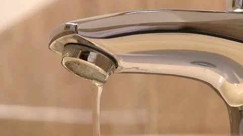 Water pouring from a tap Video stock 12284653