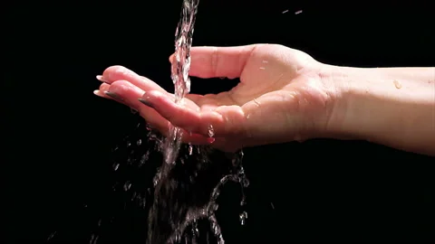 Water Pours on Hand Stock Footage 144375925