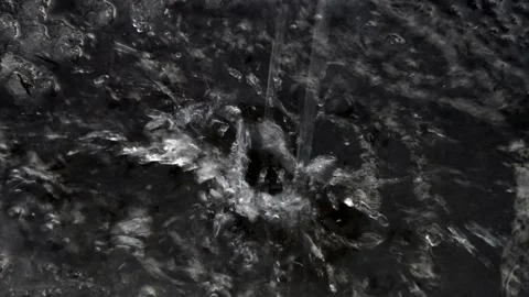 Water pours on an iron sheet Stock Footage 238649896