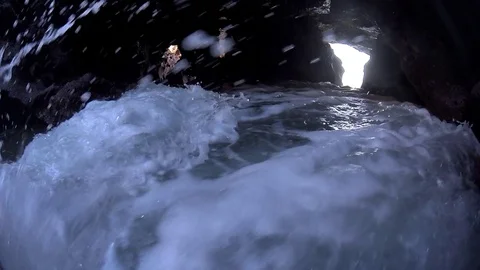 Water pressing into cave loopable Stock Footage 82659890