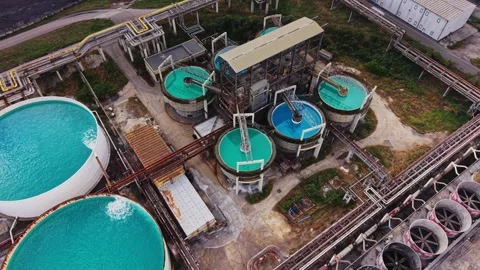 Water processing facility with large tanks and pipes in operation Stock Footage 340383167