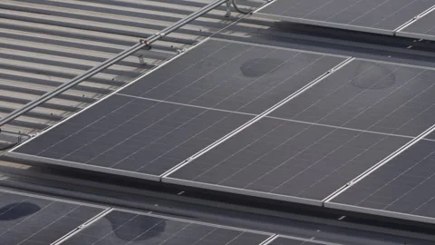 Water puddle and stains on solar panels are mineral deposits left when rain.. Stock Footage 337534502