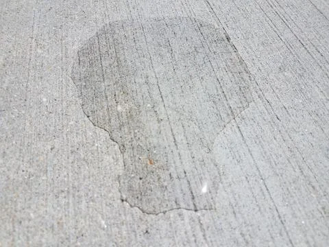 Water puddle on cement Stock Photos