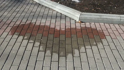 The water puddle in the shape of a heart front view. A woman with a bag in warm Stock Footage 87668315