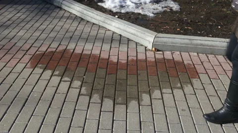 The water puddle in the shape of a heart front view. The young girl has passed o Stock Footage 87736285