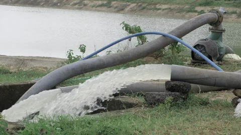 Water Pump in Action - Efficient Water Delivery in Natural Setting Stock Footage 318455102