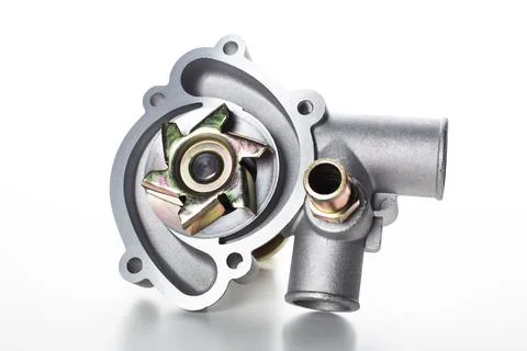 Water pump assembly displayed on a white background highlighting its design and Stock Photos