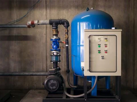 Water pump booster system panel for piping Stock Photos