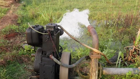 Water pump generating a stream of water Stock Footage 304060861