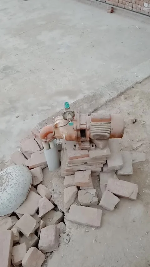 Water pump used for pumping water in the ground Stock Footage 322039767