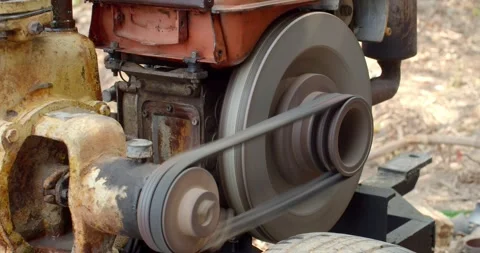 The water pump is working.The water pump uses an old diesel engine. Stock Footage 274752615