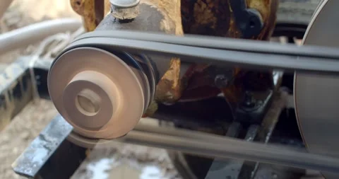 The water pump is working.The water pump uses an old diesel engine. Stock Footage 283484671