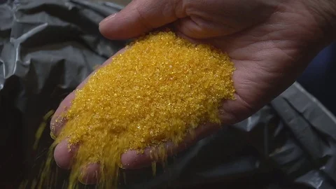 Water purification filter with charcoal, sand and zeotite, macro Stock Footage 83802723