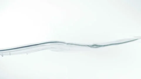 Water puring with bubbles of air in slow motion, isolated on white Video stock 107969071