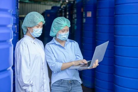 Water quality control officer engineer team inspect water tanks in beverage.. Stock Photos