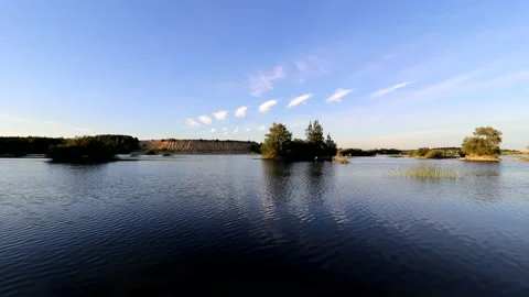 Water in the quarry in summer in the evening light . A living natural picture Stock Footage 168905167
