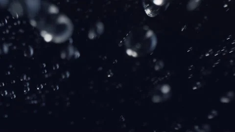 Water rain drops falling in super slow motion in 4K, real water droplets flying Stock Footage 170378907