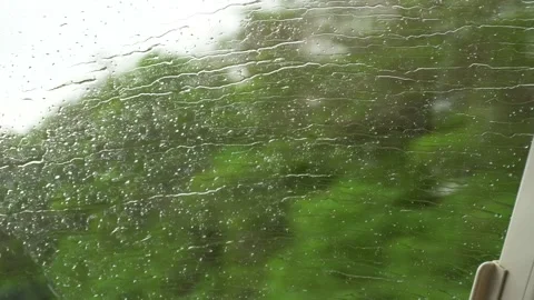 Water Rain Drops on windshield mirror glass of vehicle car bus moving water drop Vídeos de archivo 233821044