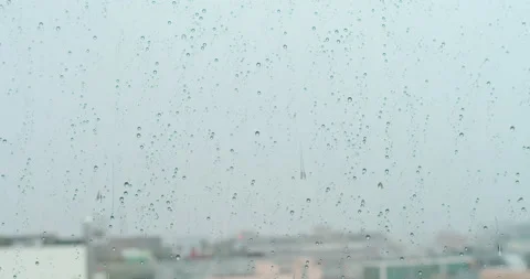 Water Rain storm falling down on glass window. Rainy season, autumn. Raindrops Stock-Footage 131660450