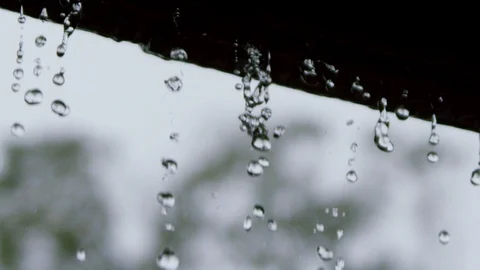 Water raindrops off of a gutter or side. slomo cu B Stock Footage 111676727