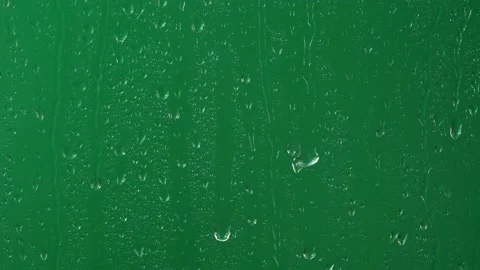 Water rainfall, rain drops falling on window glass over chroma key green screen Video stock 171903437