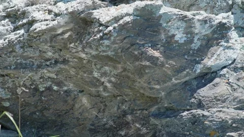 Water reflecting off rock 스톡 동영상 260850490