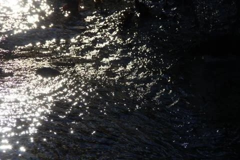 Water reflecting sunlight Stock Photos