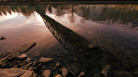 Water reflection. bridge lake panorama view. sunset mood Stock Footage 34519074