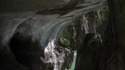 Water reflection on giant rocks in cave at Phang Nga Bay. Stockbeeldmateriaal 144681256