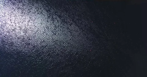 Water with a reflection of glare and ripples on the surface Stock Footage 74806437