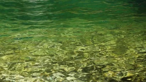 Water reflection in green hidden magic waterfall Stock Footage 112026563