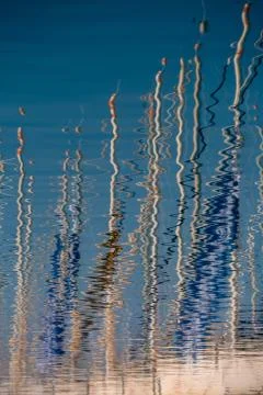 Water reflection of sailing mast Stock Photos