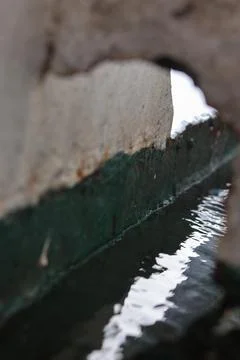 Water Reflection Seen Through Concrete Opening Fotos de archivo