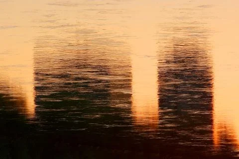 Water reflection of sunset Stock Photos